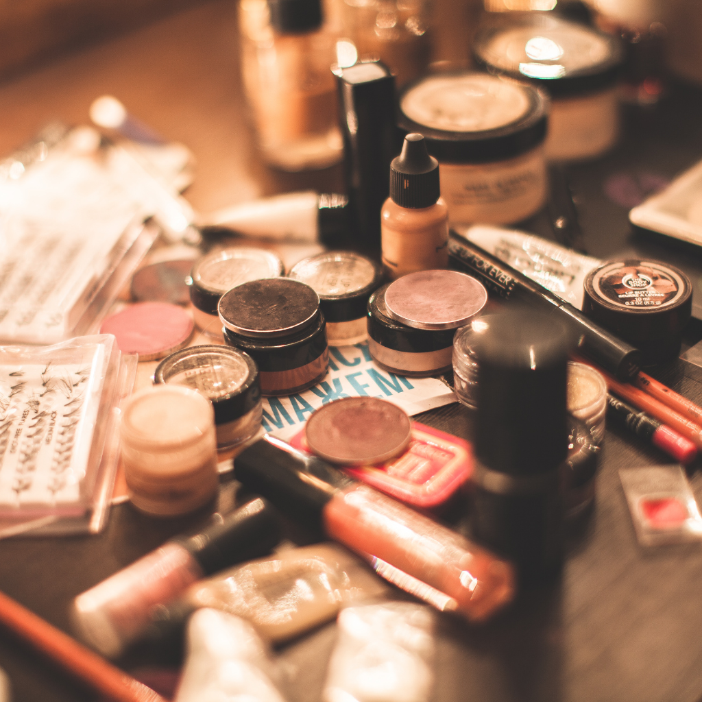 Makeup sitting on a black table.