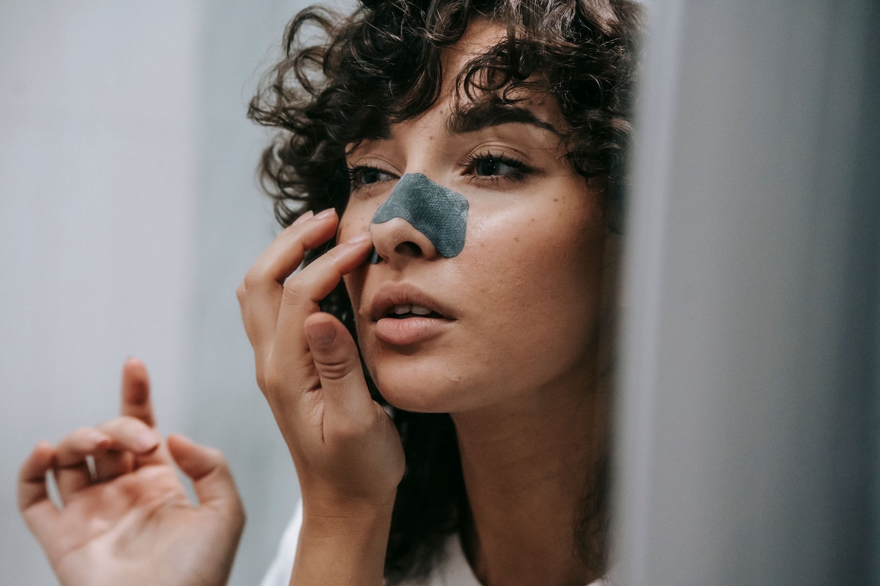 Woman with a pore strip on her face
